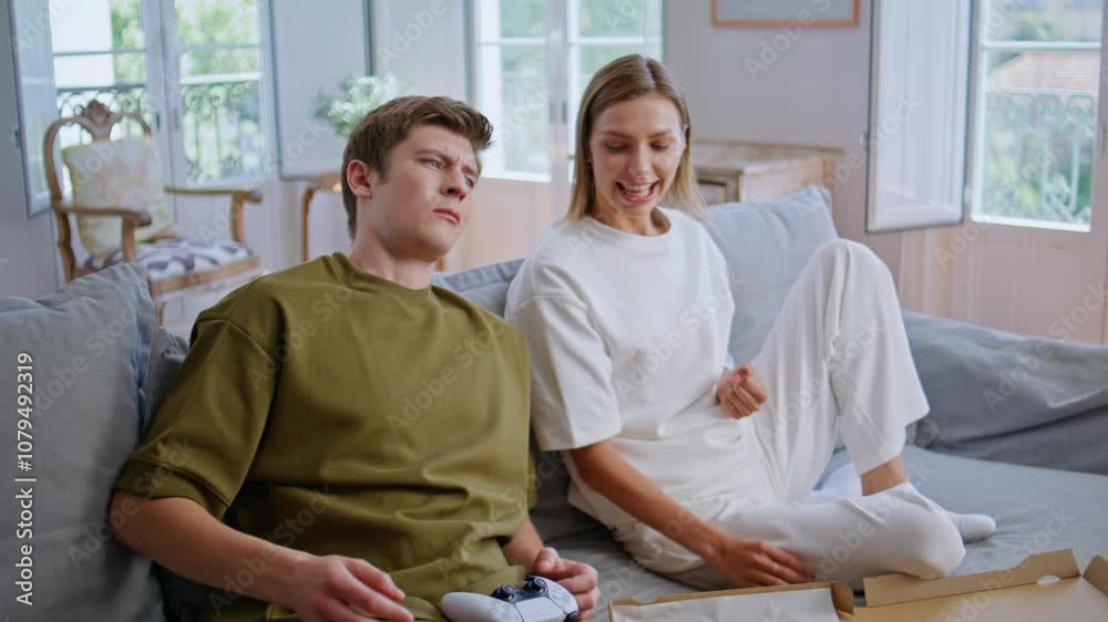 Video players sitting sofa man holding console at home closeup. Competing online Video players sitting sofa man holding console at home closeup. Competing online