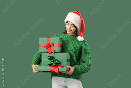 Young woman with Santa hat ...