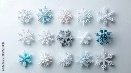 Collection of intricate snowflake designs in various shades on a light background.