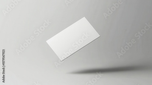 Floating Blank Business Card Mockup on Grey Background for Branding and Identity Design.