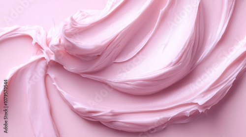 Soft pink cream moisturizer featuring a smooth wavy texture ideal for facial skincare routines