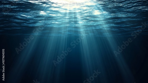 Sunbeams penetrate deep blue water.