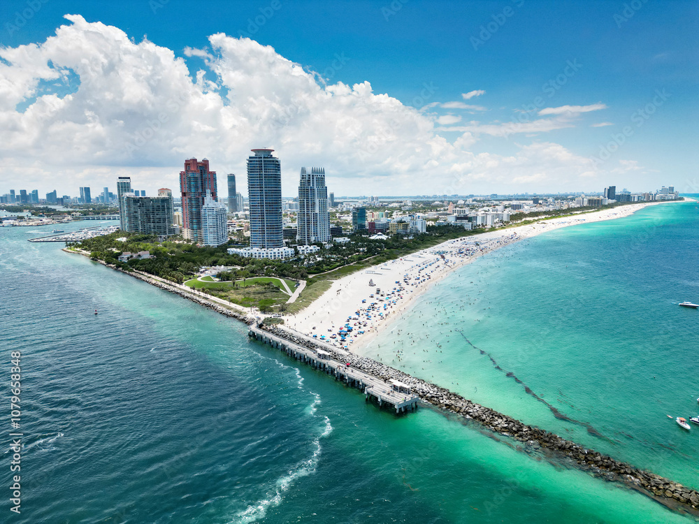 Naklejka premium Miami Beach scene from drone, Florida, USA. Miami seaside. Aerial view of Miami Beach and cityscape. Coastline of Miami Beach, aerial view. Famous American landmarks.