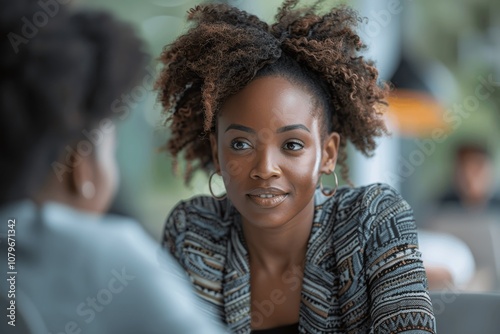 African American financial manager advising couple during office meeting