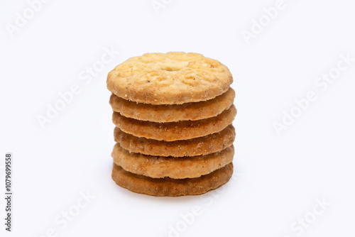 a stack of biscuits with a hole in the center on a white background