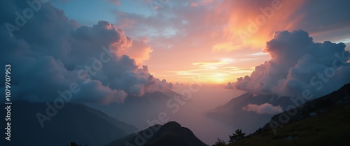  Beautiful landscape of a mountain range during sunrise or sunset. Large clouds are scattered across the sky, creating a sharp contrast to the warm colors of sunrise. For banners, posters backgrounds photo