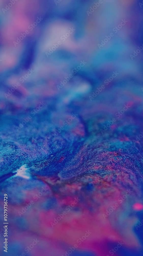 Vertical video. Ink wave. Acrylic splash. Blur neon blue pink color sparkling texture emulsion fluid mix flow motion abstract art background. Vertical video. Ink wave. Acrylic splash. Blur neon blue pink color sparkling texture emulsion fluid mix flow motion abstract art background.