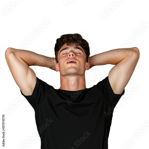 Young man relaxing with hands behind head, eyes closed photo