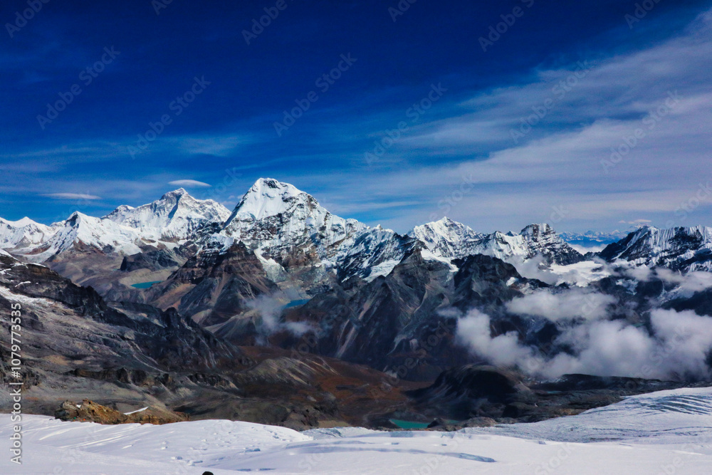 Fototapeta premium Mount Makalu,8485 m,5th highest mountain in the world,with jet streams over the summit, Chamlang,7321 m, Tutse, 6758 m, panorama from the Mera Peak summit,6461 m,Mera Peak expedition,Nepal