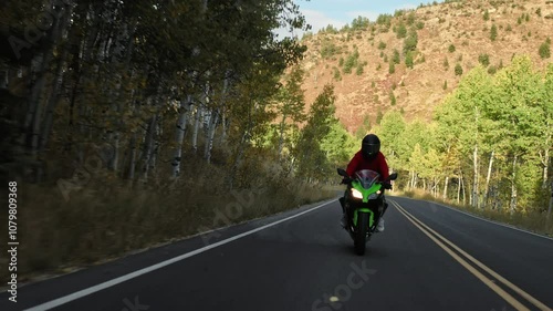Wallpaper Mural Motorcyclist riding through shadows of canyon Torontodigital.ca
