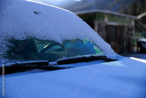 Heated front windshield melting snow in winter photo