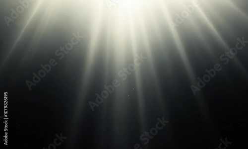 Bright ethereal light beams creating a serene atmosphere with soft glowing particles in a dark background, perfect for depicting tranquility and peace in designs