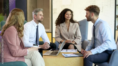 Business people shaking hands, finishing up a meeting.