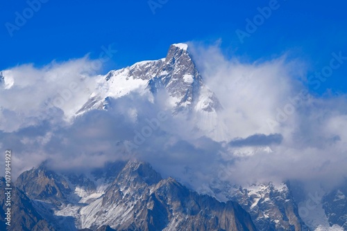 The summit of Ultar Peak (7388 m, also Ultar Sar, Bojohagur Duanasir II) - the southeasternmost major peak of Batura Muztagh, a subrange of the Karakoram range, Pakistan (as seen from Hopar Glacier) photo