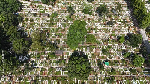 Cemetery graveyard beautiful amazing drone Aerial sky view and golden sunlight on it. Cemetery shot from the air. Huge large cemetery in a row, A high-angle drone view