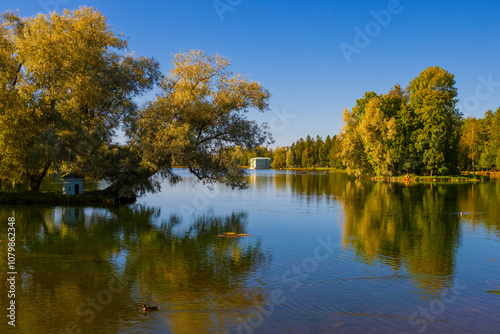 Autumn landscape. View of Lake Beloye in the Palace Park. The landscape park ensemble Palace Park was created at the end of the 18th century. Gatchina. Leningrad Region, Russia. Tourist attraction. photo