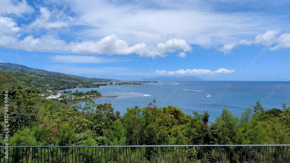Elevated view from Belvédère du Tahara'a lookout overlooking forest trees, ocean, and reefs in Papeete, Tahiti, French Polynesia Elevated view from Belvédère du Tahara'a lookout overlooking forest trees, ocean, and reefs in Papeete, Tahiti, French Polynesia