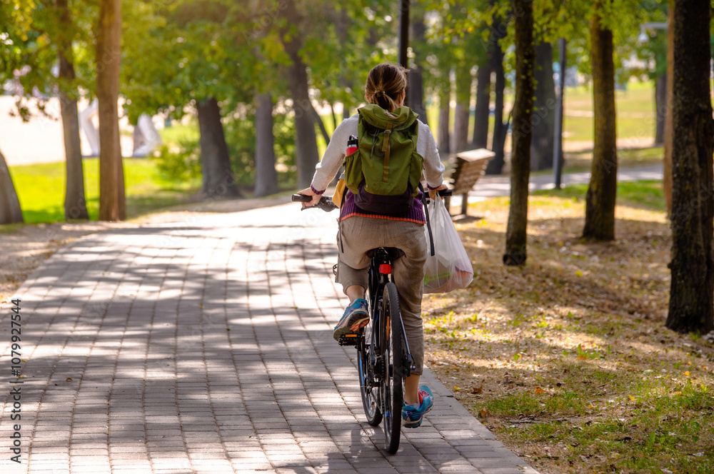 Cyclist ride on the bike path in the city Park
Cyclist ride on the bike path in the city Park