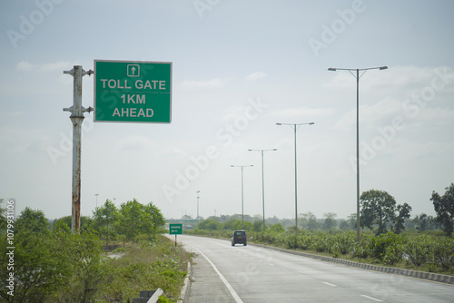 Toll Gate Sign on Indian Highway, Chhattisgarh Highway Toll Ahead, Road Signage on Rural Highway, Indian Toll Gate 1 KM Sign Stock Photo.