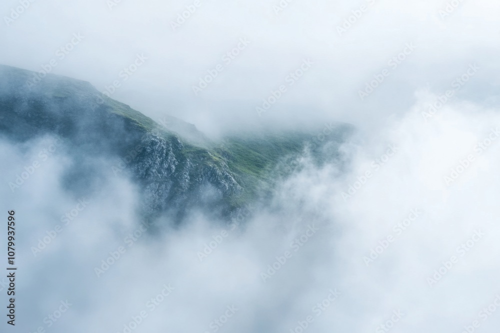 Misty mountain peak shrouded in clouds. Misty mountain peak shrouded in clouds.