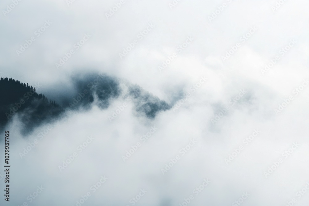 Misty mountain peak with clouds, aerial view. Misty mountain peak with clouds, aerial view.