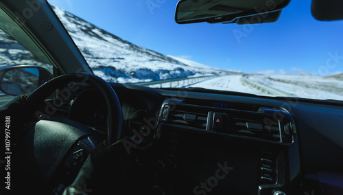 Driving  off road car on high altitude mountain top in winter Tibet, China photo