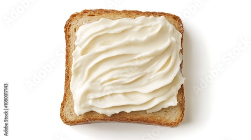 A slice of bread with a spread of cream cheese on top.