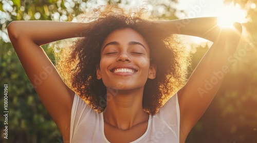Young woman enjoying the warmth of sunlight in a vibrant garden during a serene afternoon, showcasing happiness and peace