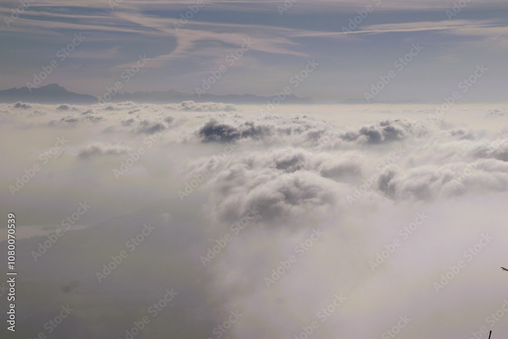 Aerial view of clouds and distant mountains. Aerial view of clouds and distant mountains.