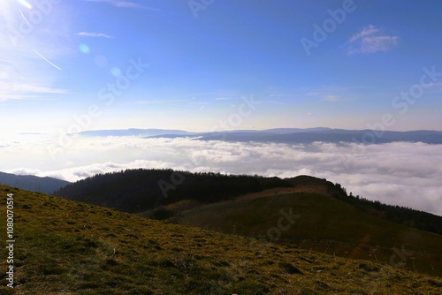 Rolling hills above a sea of clouds