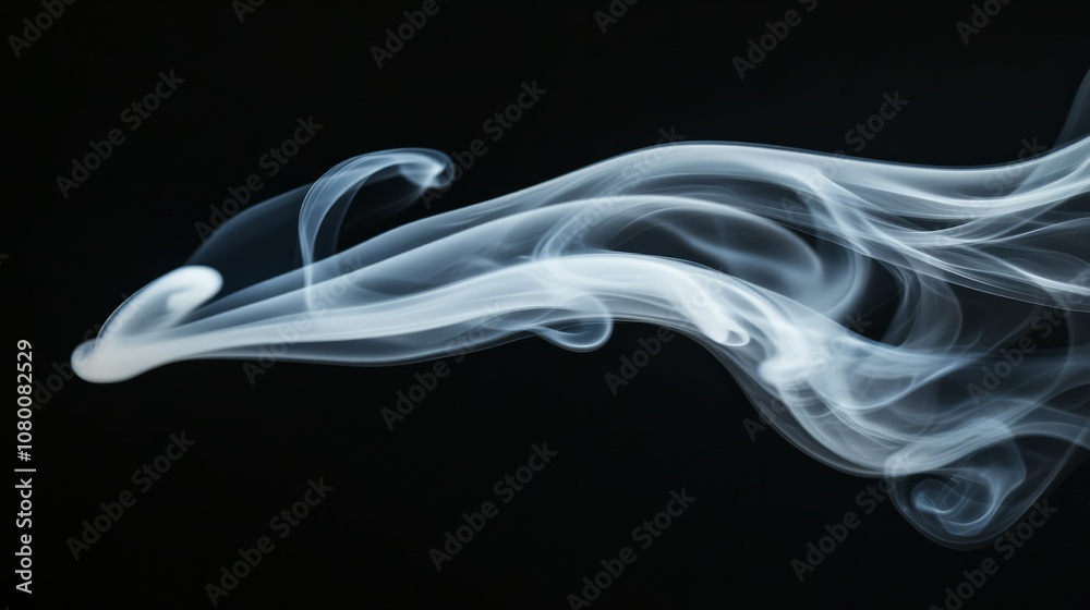 Fototapeta premium A beautifully shaped white smoke plume swirling in various directions, isolated against a solid black background