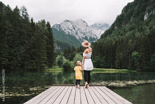 Mother and daughter together on nature. Family outdoor. photo