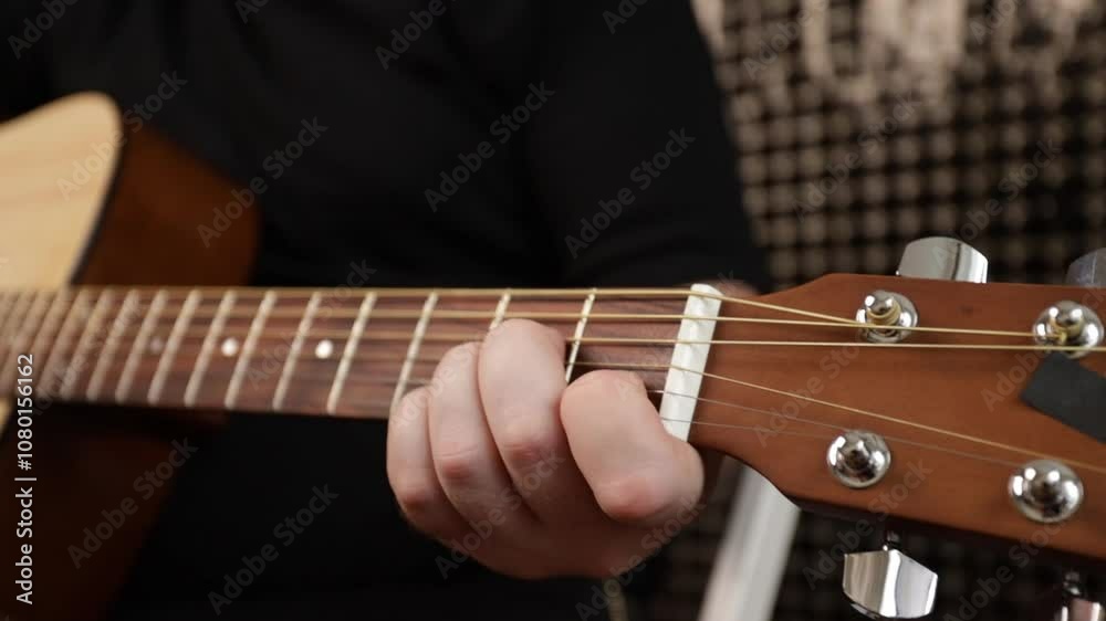 Hand Playing Acoustic Guitar Close-Up, musician focusing on fretboard details, individual enjoying acoustic lifestyle while practicing chords Hand Playing Acoustic Guitar Close-Up, musician focusing on fretboard details, individual enjoying acoustic lifestyle while practicing chords