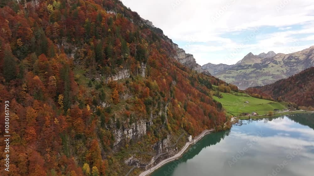 Autumn forest with cliffs and lake reflection near Klöntal, Switzerland Autumn forest with cliffs and lake reflection near Klöntal, Switzerland