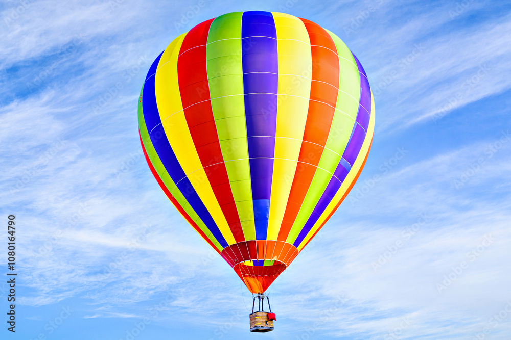 Fototapeta premium Colorful hot air balloon flying over blue sky with white clouds 