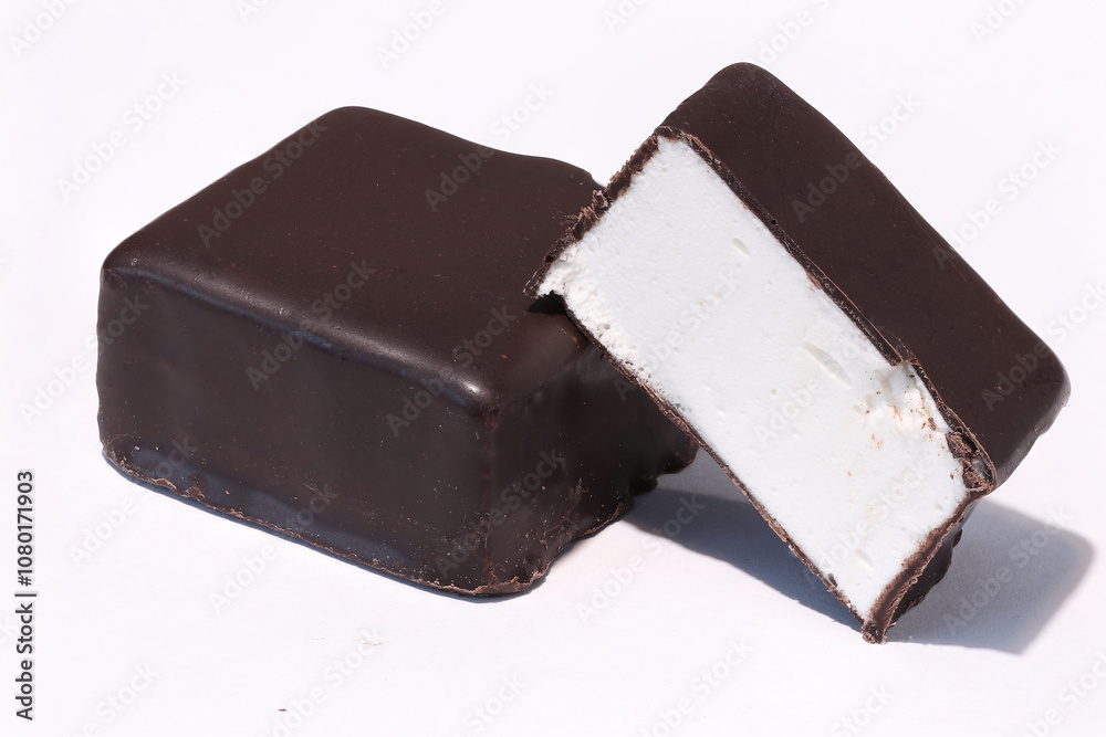 Chocolate candies with filling on a light background. milk chocolate. Chocolate candies with filling on a light background. milk chocolate.