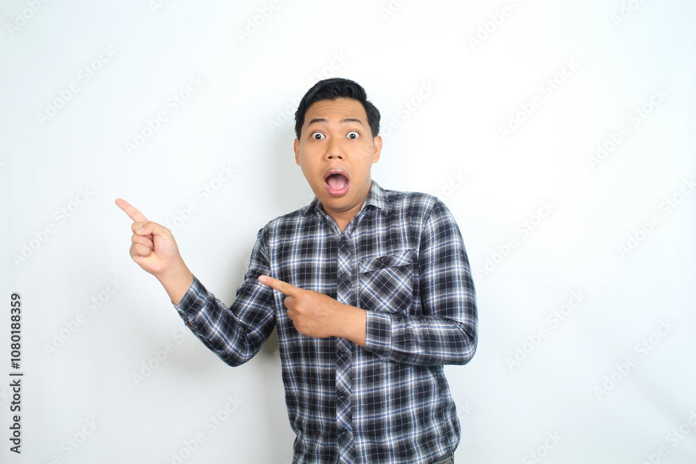 shocked asian man pointing finger with scared face isolated on white wearing casual shirt shocked asian man pointing finger with scared face isolated on white wearing casual shirt
