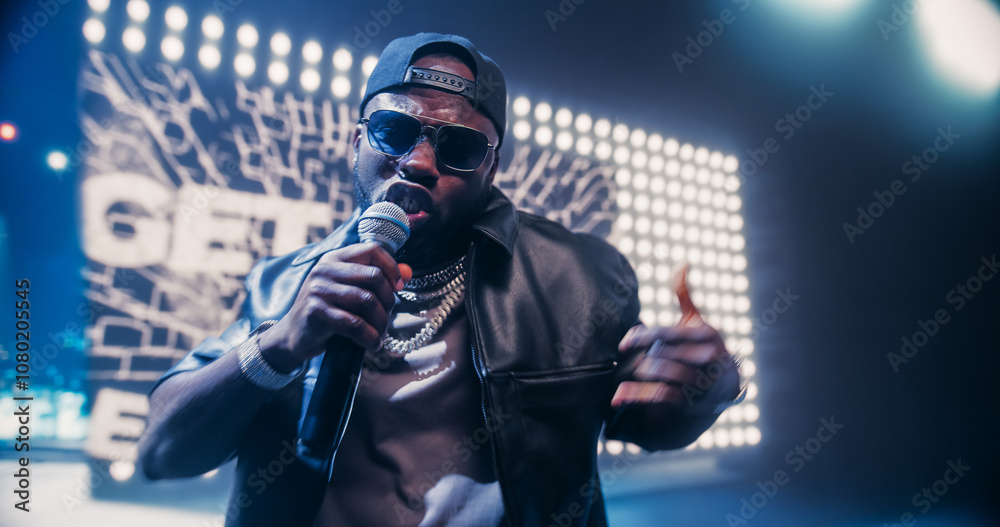 Creative Rap Artist Performing a Hit Song on Stage with a Striking Female Dancer, Inspiring a Large Audience in a Colorful Neon Concert Setting with Cinematic Lighting and Animated LED Screen Creative Rap Artist Performing a Hit Song on Stage with a Striking Female Dancer, Inspiring a Large Audience in a Colorful Neon Concert Setting with Cinematic Lighting and Animated LED Screen