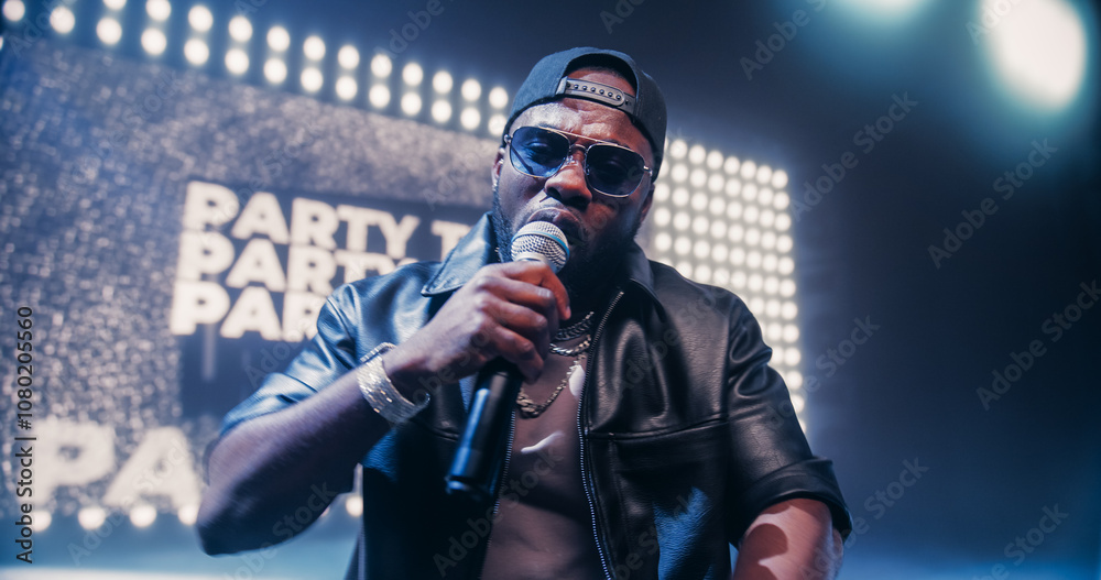 Creative Rap Artist Performing a Hit Song on Stage with a Striking Female Dancer, Inspiring a Large Audience in a Colorful Neon Concert Setting with Cinematic Lighting and Animated LED Screen Creative Rap Artist Performing a Hit Song on Stage with a Striking Female Dancer, Inspiring a Large Audience in a Colorful Neon Concert Setting with Cinematic Lighting and Animated LED Screen