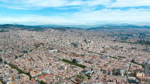 Canvas Print Aerial view of Barcelona’s vibrant cityscape under a clear blue sky, showcasing