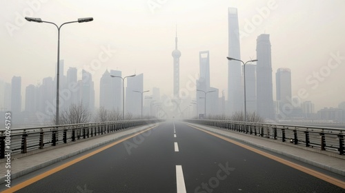 A foggy cityscape featuring tall skyscrapers and a deserted road leading to a distant skyline.