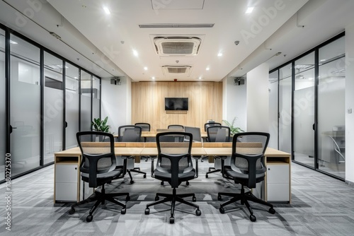 Modern Office Interior with a Row of Desks and Chairs