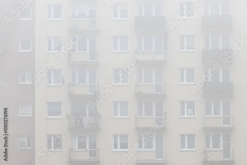 Residential building, multi-family skyscraper type in the fog