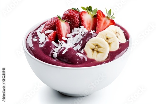 Berry smoothie bowl topped with banana slices, fresh strawberries, and shredded coconut. Healthy breakfast or snack concept