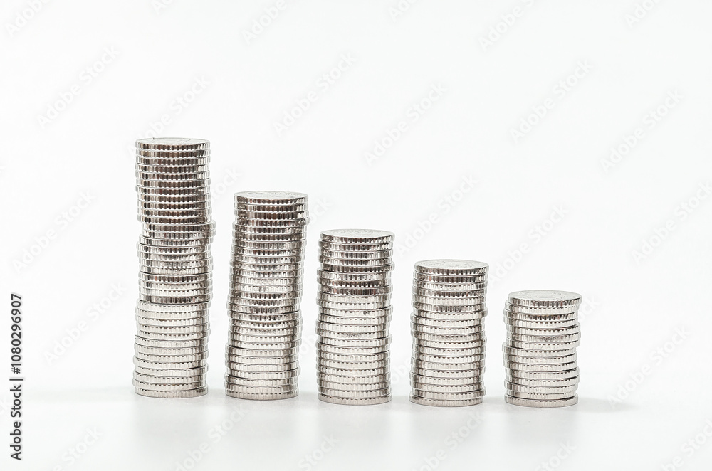 Pyramid of silver coins, from larger to smaller. Falling economy, decreasing profits. White background. Pyramid of silver coins, from larger to smaller. Falling economy, decreasing profits. White background.