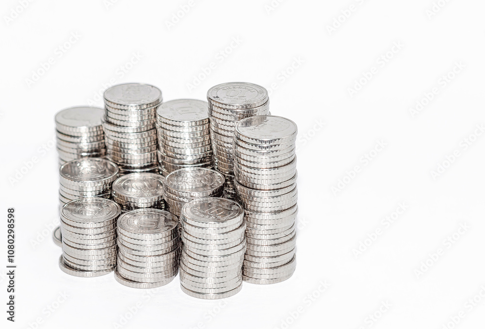Detailed view columns of silver coins. Isolated on white. Idea of business and finance. Copy space. Detailed view columns of silver coins. Isolated on white. Idea of business and finance. Copy space.