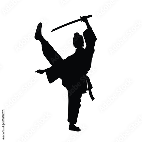 A person in a black outfit holding a sword. The person is in a split position. The sword is held in the right hand