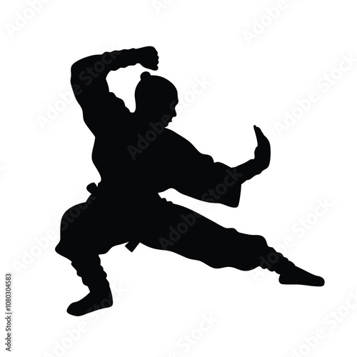 A man in a black outfit is doing a martial arts pose. He is holding his arms out to the side and has his hands in the air