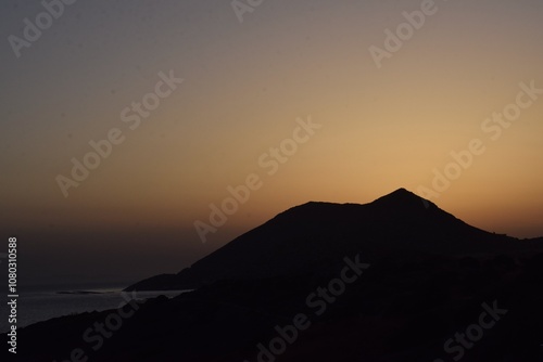 sunset over the mountains by the sea