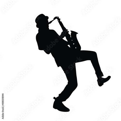 A man playing a saxophone. He is wearing a hat and is bending over. The saxophone is in his right hand